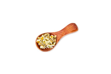 Dry chamomile flowers in a wooden spoon isolated on white background. Soothing chamomile tea. Herbal drink. Medical prevention and immune concept. Folk medicine, alternative, traditional medicine.