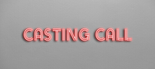 Casting call neon text on a grey wall