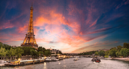 Fototapeta na wymiar Eiffel tower in Paris, France with Scenic panorama of the river Seine under the twilight skyline with port of Seine river