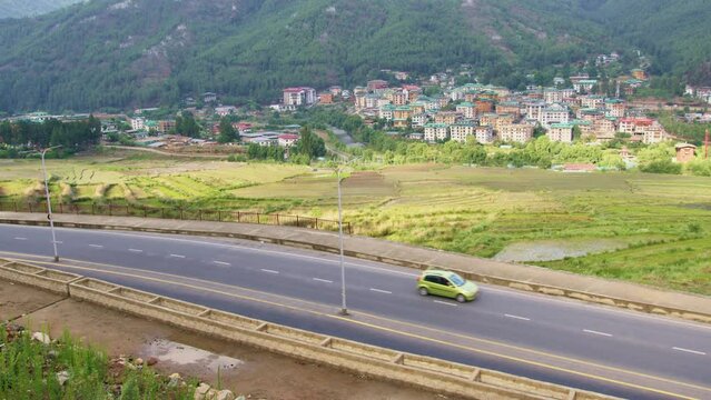 View of vehicles on a road in Thimphu city located in Bhutan