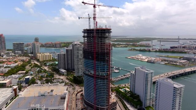 Aerial drone orbit Five Park Miami Beach Condominium under construction site 4k