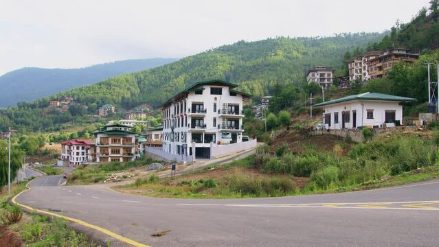 View of vehicles on a road in Thimphu city located in Bhutan