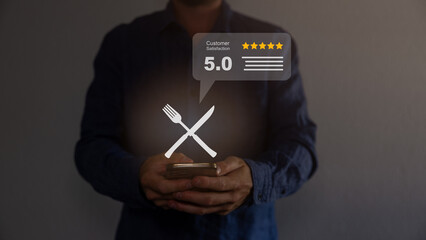 Hand touching and doing mark to five yellow stars on restaurant background, the best customer satisfaction and evaluation for good quality food and service. Best score evaluation for customer reviews.