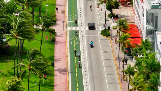 Aerial tight shot Miami Beach Ocean Drive bike lanes 4k 2023