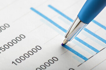 Accounting document with pen, money, coins and checking financial chart. Concept of banking,...