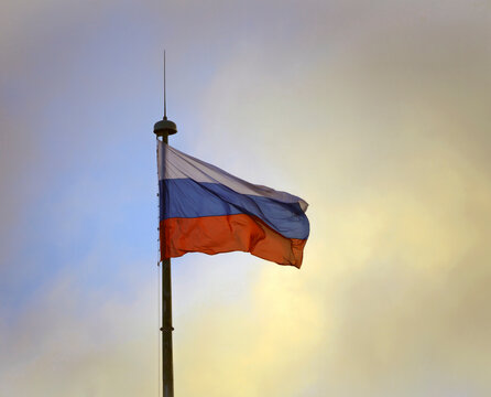 White-blue-red state flag of the Russian Federation is waving in the wind.