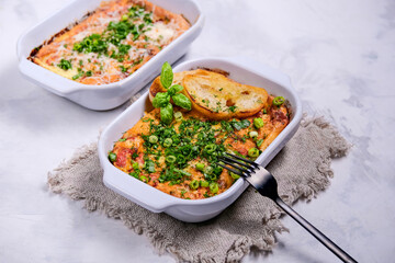 Oven baked frittata with mediterranen vegetables such as zucchini, tomatoes, bell peppers and red onions. Served in a rustic cast.