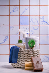 Brushes, sponges, rubber gloves and natural cleaning products in the basket. Eco-friendly cleaning products