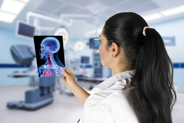 Woman Doctor examine a colored x-ray