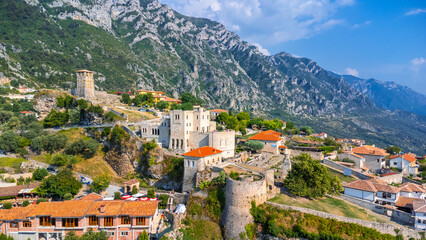 Fototapeta na wymiar Aerial drone view of Kruje Castle and its fortress, inside the Kruje tower and museum with the mountains in the background. Albania
