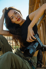Fototapeta na wymiar Inspired female photographer enjoys shooting in the nature