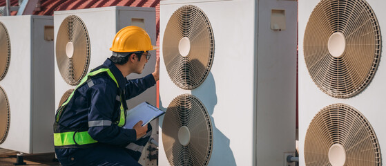 Engineers is checking the air conditioning cooling system of a major building or industrial...