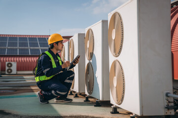 Engineers is checking the air conditioning cooling system of a major building or industrial...