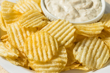Fototapeta na wymiar Organic Crinkle Potato Chips and French Onion Dip