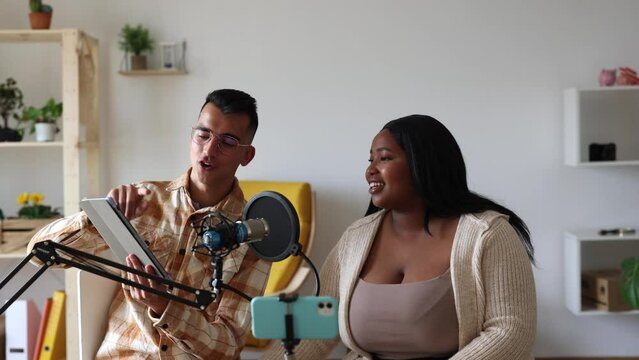 Influencers collide speak on a vlogging live stream via home camera - radio podcast -