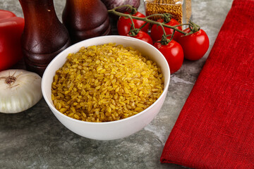 Dry wheat bulgur cereal heap