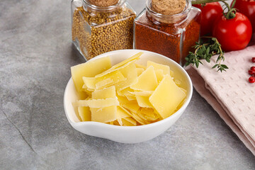 Sliced parmesan cheese in the bowl