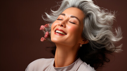  a woman with grey hair and a white shirt