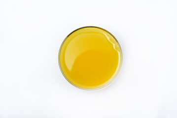 Glass glasses with orange juice on a white background. Delicious orange cooling drink.