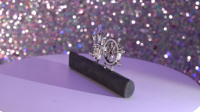 skeleton hand made of metal with steering wheel as seafarer symbol, pirate