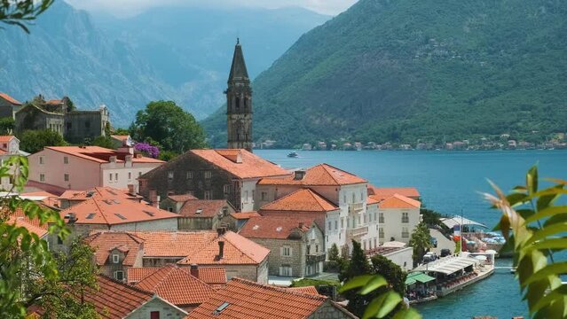 Aerial view of old town of Perast in the Bay of Kotor on Adriatic sea in Montenegro in sunny day. Popular summer vacation destination