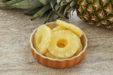 Marinated pineapple rings in the bowl