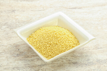 Raw couscous in the bowl