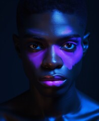 This portrait captures the bold and beautiful colors of neon, showing off the dramatic makeup on the queer gay lgbt man mysterious smoke that lingers around eyebrows, lips, eyelashes, forehead, jaw