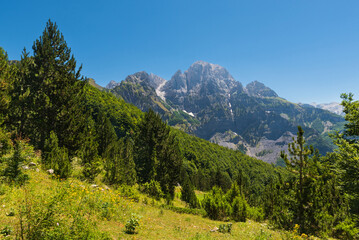 Fototapeta na wymiar Panoramic views of raw mountain landscapes from the Albanian Alps between Theth and Valbona, Albania
