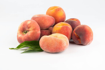 Peaches of various shapes on a white background. Fruit background.