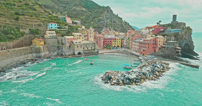 Aerial drone landscape of Vernazza, Italy Colorful Cliffside Town the Seaside Mountainous of famous Cinque Terre, Liguria, Northern Italia on Tyrrhenian sea in summer day. Coastal travel village.