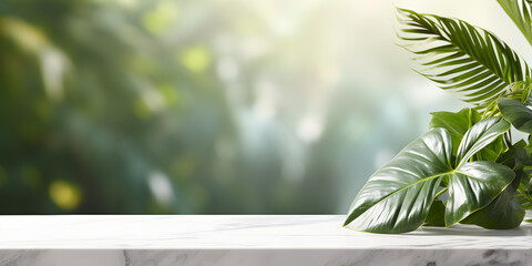Light marble table over blurred tropical leaves background