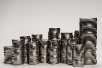 Pile of coins isolated on a white background.