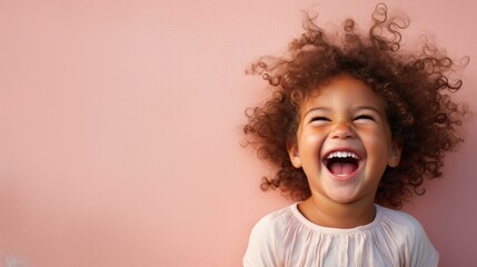 Toddler's infectious laughter, eyes sparkling with mischief. Background: Plain pastel - colored wall.