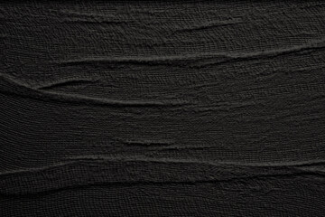 Empty crumpled wet canvas fabric blank texture copy space wave background. Black color.