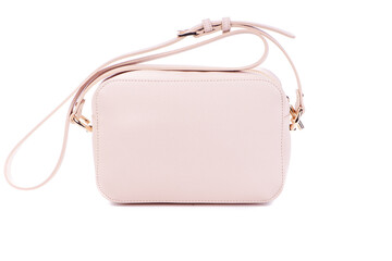 Small Pink leather cross-body bag isolated against a white background with space for text. Concept...