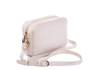 Side photo of  beige leather cross-body bag with space for text. Concept of versatile female accessories. Fashion blog. Advertising for boutiques and shops. Retail, e-commerce store