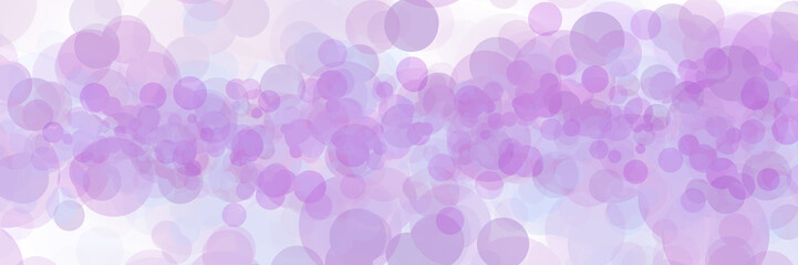 Many circles of different sizes in tones of purple, placed on a white background imitating bokeh.