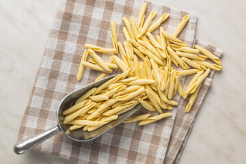 Fusilli pugliesi. Italian twisted pasta in scoop. Top view.