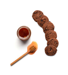 Honey and homemade cookies on a white background top view.