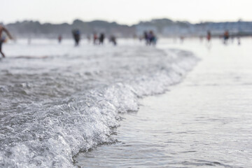 beach scene captures the essence of a scorching summer day, where people revel in the refreshing...