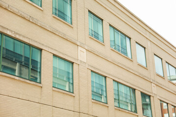 modern building, a symbol of urban growth and real estate prosperity, blends metal and stone to shape our skyline and secure mortgages for future dreams