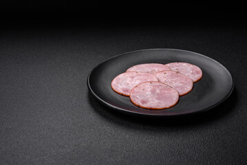 Delicious fresh ham cut into round slices with salt, spices and herbs