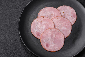 Delicious fresh ham cut into round slices with salt, spices and herbs