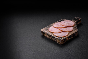 Delicious fresh ham cut into round slices with salt, spices and herbs