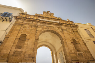 Obraz premium The Porta Nuova in Marsala, entrance gate in historic centre of town at Sicily, Italy, Europe.