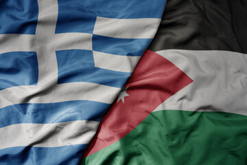 big waving national colorful flag of greece and national flag of jordan .