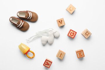 Composition with baby accessories and toys on light background