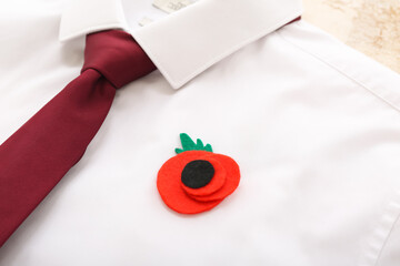 Poppy flower pinned on male clothes. Remembrance Day in Canada