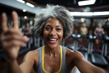 Tableaux sur verre Fitness Afro american female athlete smile, take selfie for blog inspiration and progress post. Fitness, exercise fitness gym selfie portrait of woman happy about workout, training motivation, body wellness.